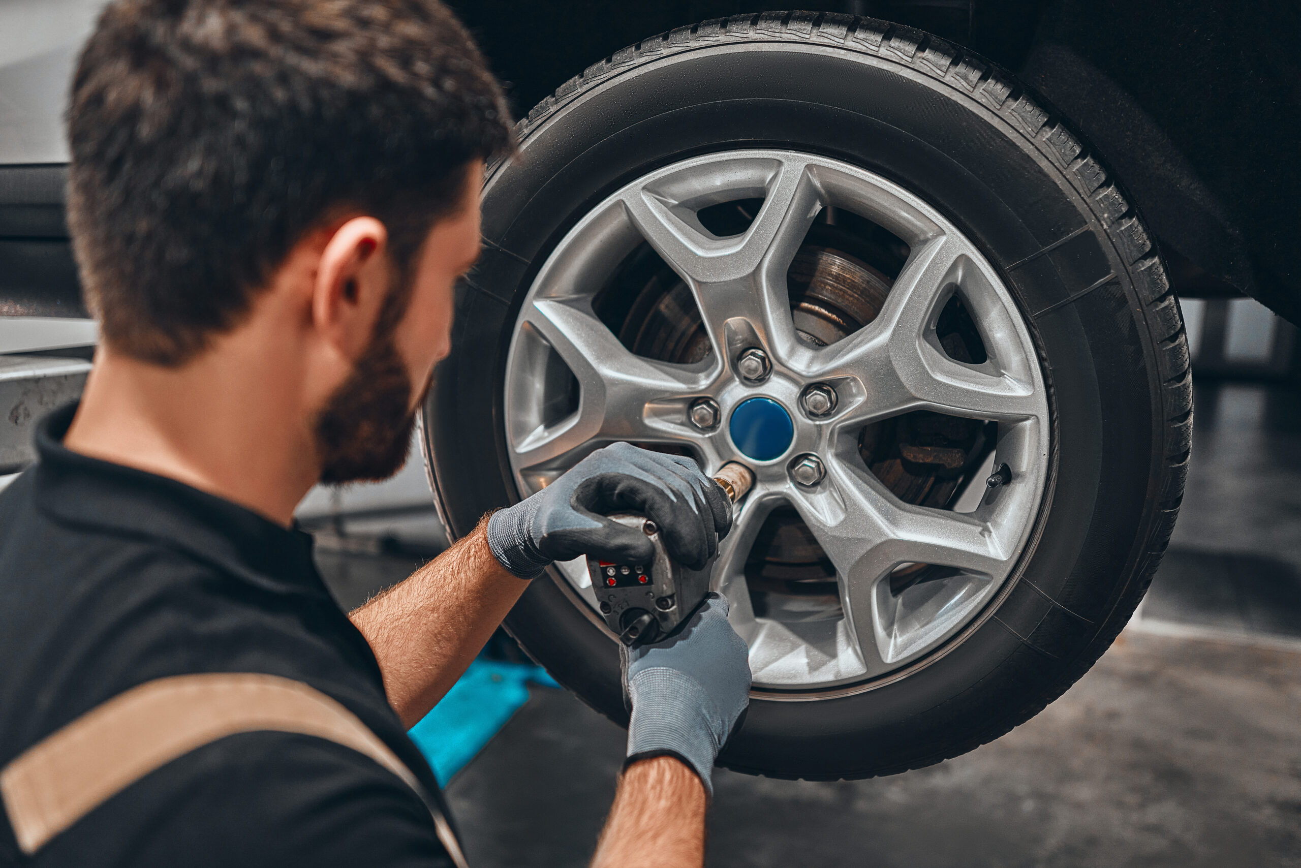 A mechanic repairing rim